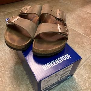Brown Birkenstocks ! Can lower ! Need gone !